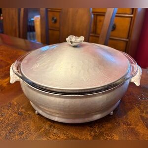 Vintage Pyrex and hammered aluminum covered casserole dish.